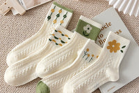 Adorable, pastel-colored socks adorned with tiny heart patterns bring a sweet and charming look to your wardrobe.