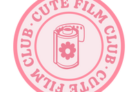 The Cute Film Club logo.  A pink circle with the image of a film roll with a flower on it, surrounded by the club name