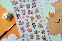 Colorful stickers featuring cute bear characters in various activities from the STICKII Monthly Sticker Subscription box