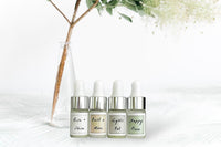 Four Mini Essential Oil Droppers by Greenmade goods. Scents: Rise + Shine, Bust a Move, Lights Out, Happy Place.
