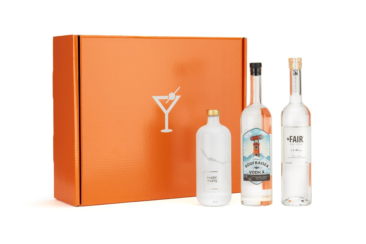 An orange box with three full size of curated liquor from Tipxy Flight Club. Best liquor subscription boxes for men.