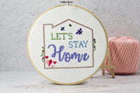 quote, lets stay home inside back stitching of house outline on counted cross stitch design with hearts, butterflies