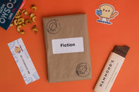 Read It & Eat Blind Date with a book.  Each box contains a food story, an artisanal snack, and a $5 donation to fight hunger in Buffalo, NY