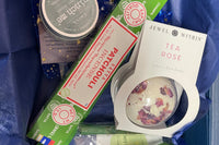 Tea rose bath bomb , patchouli incense, crystals and more. We aimed to create more of a green themed box for The month of March! 