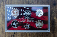 United States Mint State Quarters Silver Proof Set including 5 silver coins in a sealed collector's box.