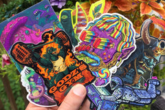 Colorful assortment of stickers from the Monthly Sticker Savages Box featuring monsters and whimsical designs for water bottle stickers