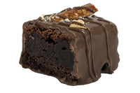 Close-up image of the Guinness Brownie Bite. This is our classic brownie infused with reduced Guinness, dipped in milk chocolate.