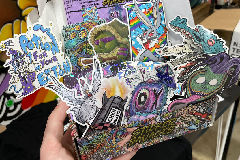 Colorful assortment of stickers from the Monthly Sticker Savages Box featuring monsters and whimsical designs for water bottle stickers