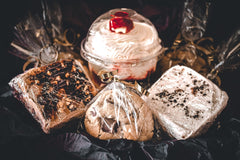 Fudgey brownies loaded with decadent toppings such as cream cheese buttercream and bits of Oreos or caramel and pecans. 