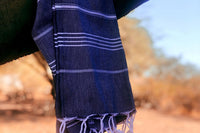 A turkish towel hanging as an example of something that has been previously included in the subscription box.