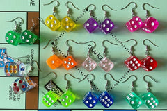 Colorful assortment of unique earrings including food and whimsical designs in the Monthly Earring Mania subscription box