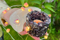 Create a cozy home atmosphere with an amethyst chips candle holder, tea light candle inside, a selenite moon bowl and amethyst lights