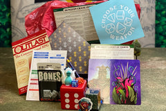 Dungeon Crate™ subscription box featuring exclusive member card, flame miniatures, and a treasure token for roleplaying games