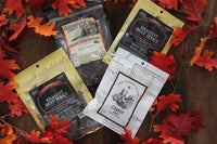 Brandt Orange teriyaki, Smokehouse Garlic Pepper, Brandt Original, and Side Project Cowboy flavors. Spread across fall leaves. 