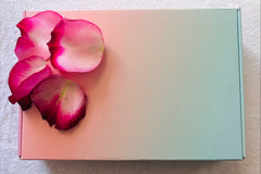 closed subscription box with rose petals as decoration