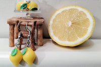 Colorful assortment of unique earrings including food and whimsical designs in the Monthly Earring Mania subscription box
