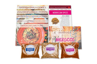Spice Madam Monthly Subscription box featuring spice packets and recipe cards surrounded by illustrated food items