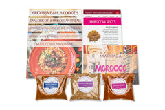 Spice Madam Monthly Subscription box featuring spice packets and recipe cards surrounded by illustrated food items