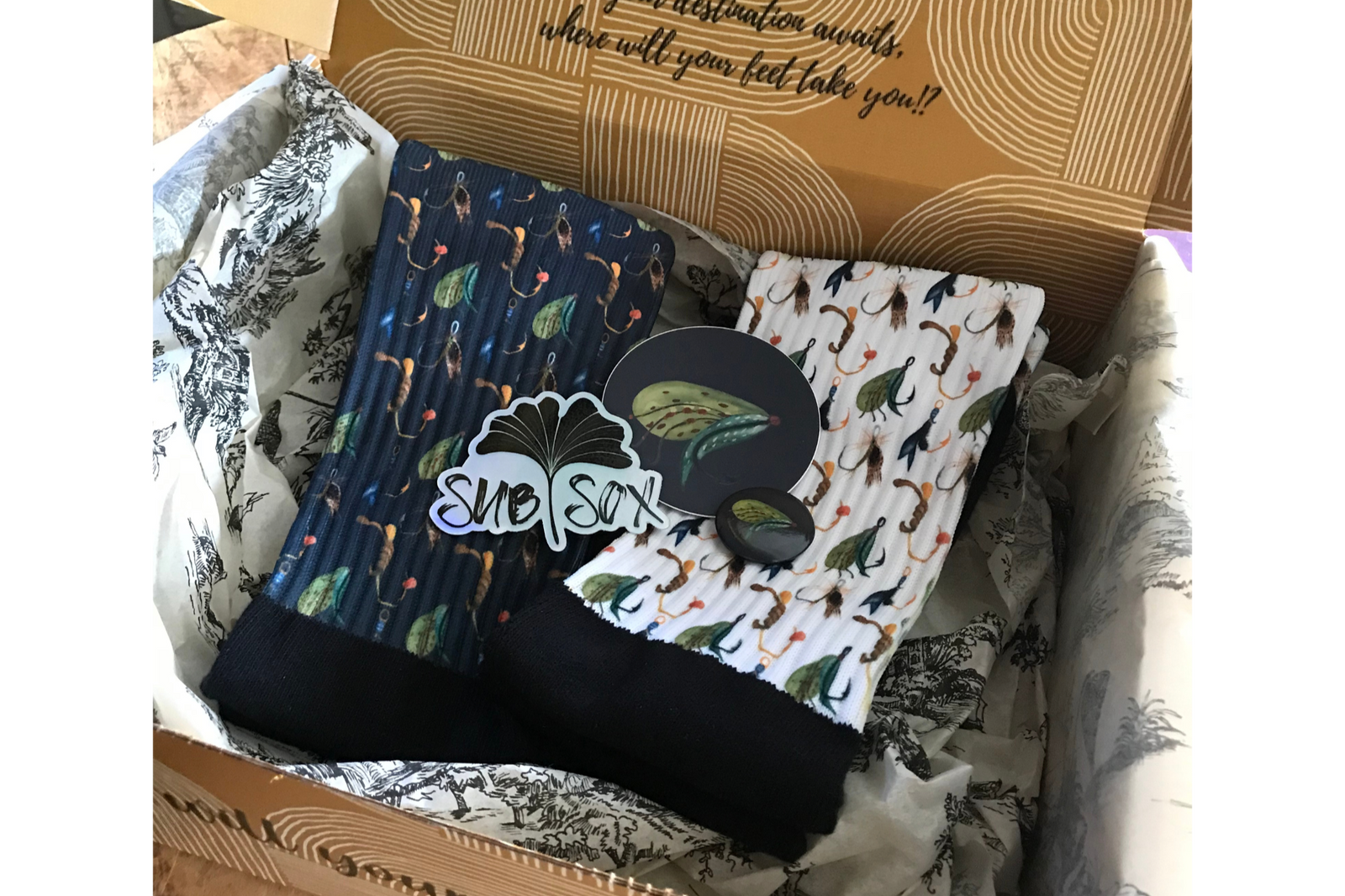 Each box will house two socks, stickers, a pin, OR magnet.  I try to keep an element of surprise, to keep you wanting more.