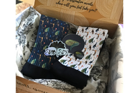 Each box will house two socks, stickers, a pin, OR magnet.  I try to keep an element of surprise, to keep you wanting more.