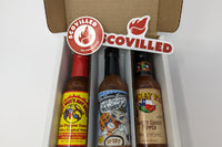 SCOVILLED hot sauce of the month subscription box featuring Dirty Dick's, Torchbearer Sweet Onion Habanero, and Mikey V's Sweet Ghost Pepper