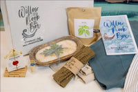 The 2022 Winter & Spring Launch Box.  Handmade candle and soap, basil growing kit, fingerless gloves, Turkish towel and linen apron.
