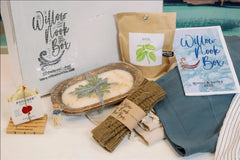 The 2022 Winter & Spring Launch Box.  Handmade candle and soap, basil growing kit, fingerless gloves, Turkish towel and linen apron.