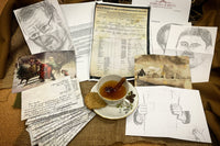 This box shows a number of letters, sketches and vintage christmas cards and postcards as well as a cup of chai tea
