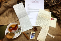 Clay diya, cinnamon, a small stick of unknown purpose, coded notes, ships ticket and a special letter and newspaper article.