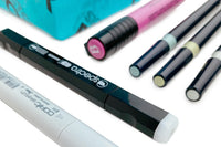 SketchBox subscription box featuring art supplies like markers, a notebook, and a brush for creative projects
