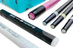SketchBox subscription box featuring art supplies like markers, a notebook, and a brush for creative projects