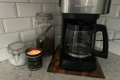 An example of our 10 oz. scented candle next to kitchen appliances for size reference. Fragrances and quotes will vary.