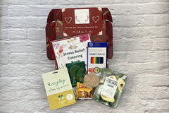 The Stress Relief Adult Coloring Book Box will include a book, an adult coloring book, colored pencils, as well as 2 - 3 self-care products.