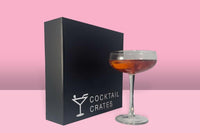 Cocktail subscription box from Cocktail Crates showing a manhattan cocktail and the ingredients needed to make this drink