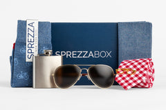 A SprezzaBox monthly subscription box featuring a watch, tie, socks, and a wooden comb for men's accessories