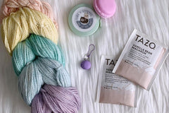 A sample of the Hand Dyed Yarn, stitch marker and extra items that will be offered in each quarterly box.