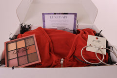 Glam Luxe fashion and beauty box with an eyeshadow palette, earrings, and a rust 2 piece matching set. (perfect for fall)