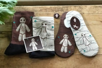 Voodoo how to playful socks.  You will get two color options, unless noted differently.  Also featured a button, sticker, and magnet.