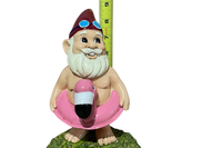 Gnome of the Month Club subscription box displayed on a front porch surrounded by neatly trimmed bushes
