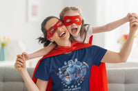 Woman and young girl playing superheroes and wearing red superhero masks. The lady is wearing a Captain America Tshirt.