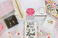 A cozy arrangement of fall-themed items in the Believer's Box VP, featuring socks, a candle, and a faith-inspired book