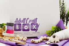 Adult Craft Box Subscription. Display of the box packaging and craft materials. Crafting for adults. 