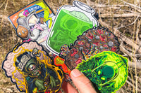Colorful assortment of stickers from the Monthly Sticker Savages Box featuring monsters and whimsical designs for water bottle stickers