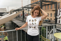 A lady standing on an outside deck holding back her hair and wearing a Harry Potter inspired Potter Cats TShirt.
