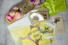 July 2023 box--You can always expect a carefully curated box with great yarn and 3-4 fun notions with a tea sampler.