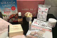 Bubbles & Books subscription box featuring a romantic novel, handmade soap, and bath products for relaxation