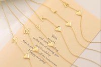 Elegant 14k gold heart pendant with a gold initial pendant built on the chain making this dainty chain one of a kind