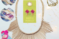 A gift of the Oliver Christopher's Boutique Box, necklace, earrings, and a pair of earrings from Oliver Christopher's Boutique.