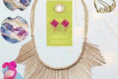 A gift of the Oliver Christopher's Boutique Box, necklace, earrings, and a pair of earrings from Oliver Christopher's Boutique.