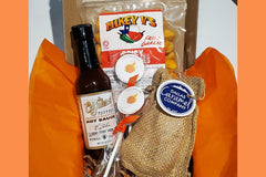 Hot sauce, spicy lollipops, spicy chipotle caramels and spicy fried garlic in our mini box. Mini spicy boxes include 3-4 spicy items